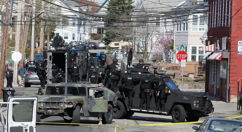 A SWAT unit searches for 19-year-old Boston Marathon bombing suspect Dzhokhar A. Tsarnaev...