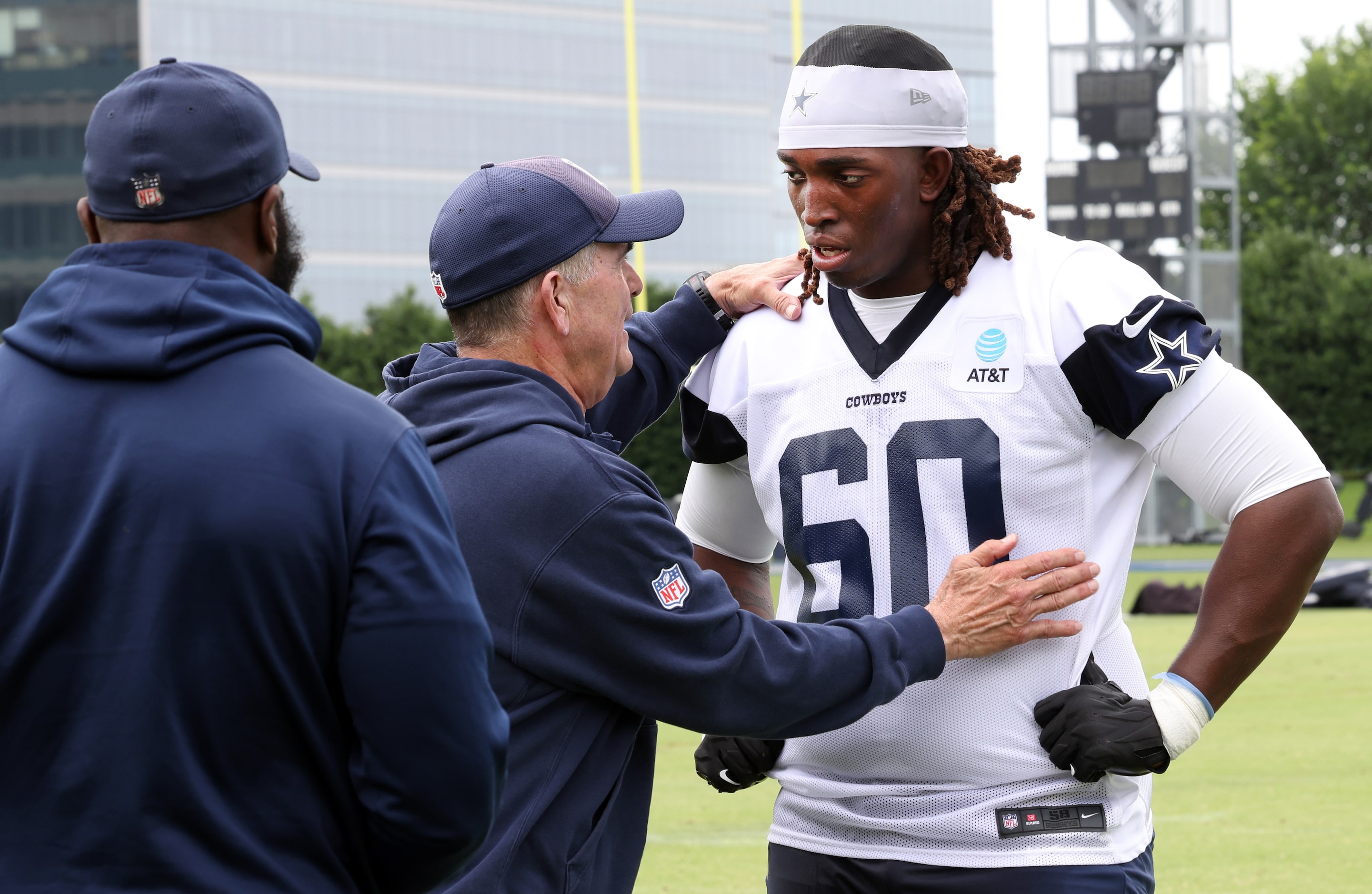 Dallas Cowboys offensive lineman Tyler Guyton (60) listens intently to offensive line coach...