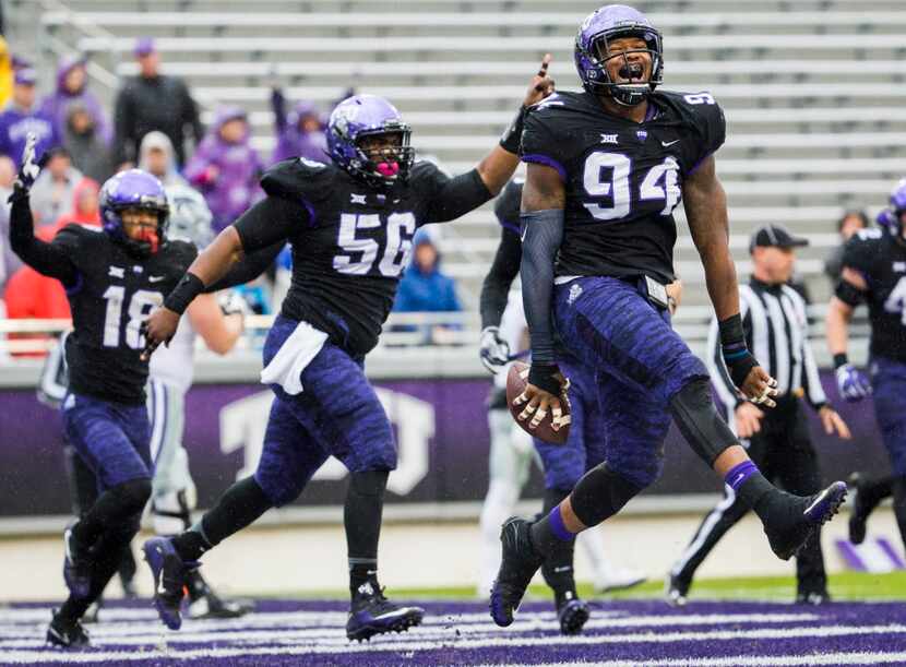 TCU Horned Frogs defensive end Josh Carraway (94) celebrates after recovering a fumble and...