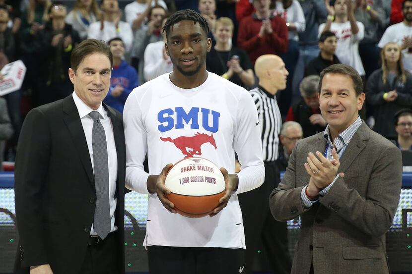 SMU guard Shake Milton (1) receives a commemorative ball denoting 1,000 career points from...