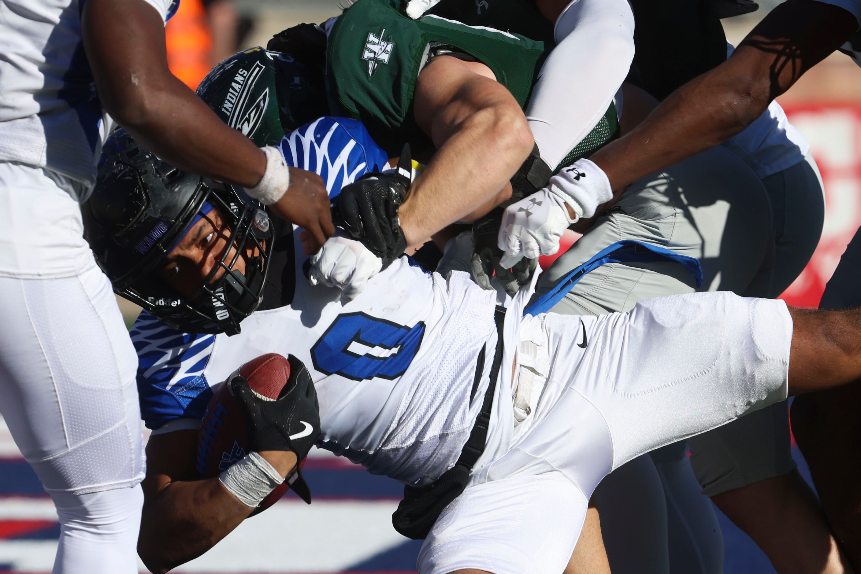 North Forney High’s Kellen Sanders (0) is Brough down by Waxahachie High defense during the...