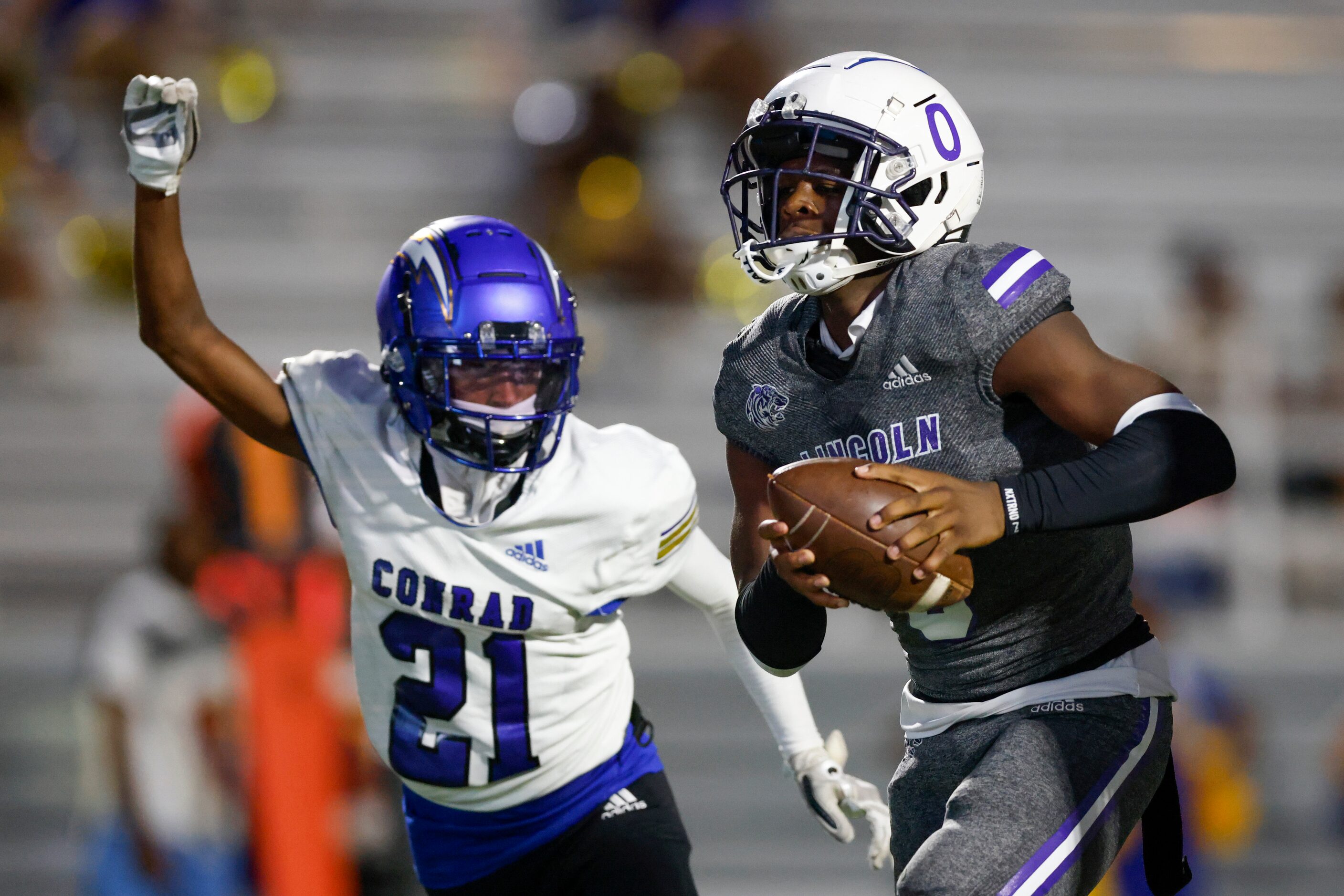 Lincoln quarterback Jasten Hamilton (0) rushes for a touchdown ahead of Conrad linebacker...