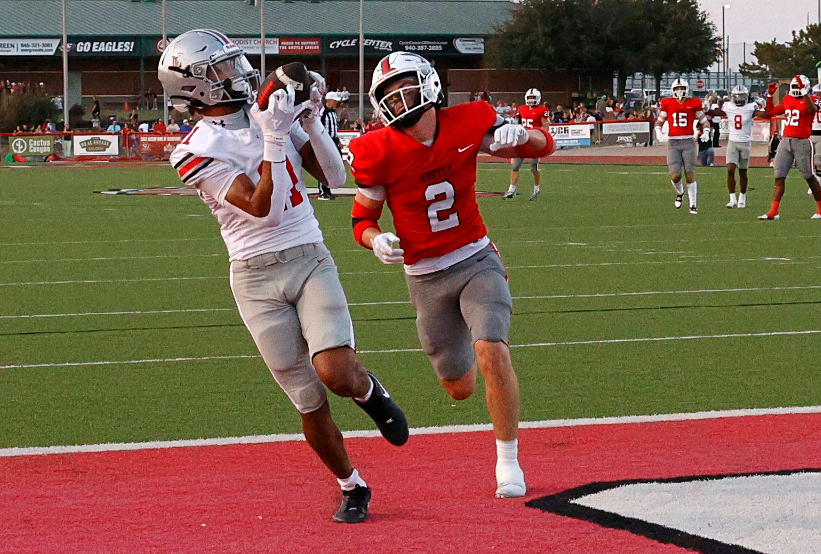 Lovejoy's Daylan McCutcheon (11) catches a pass and runs into the end zone for a touchdown...