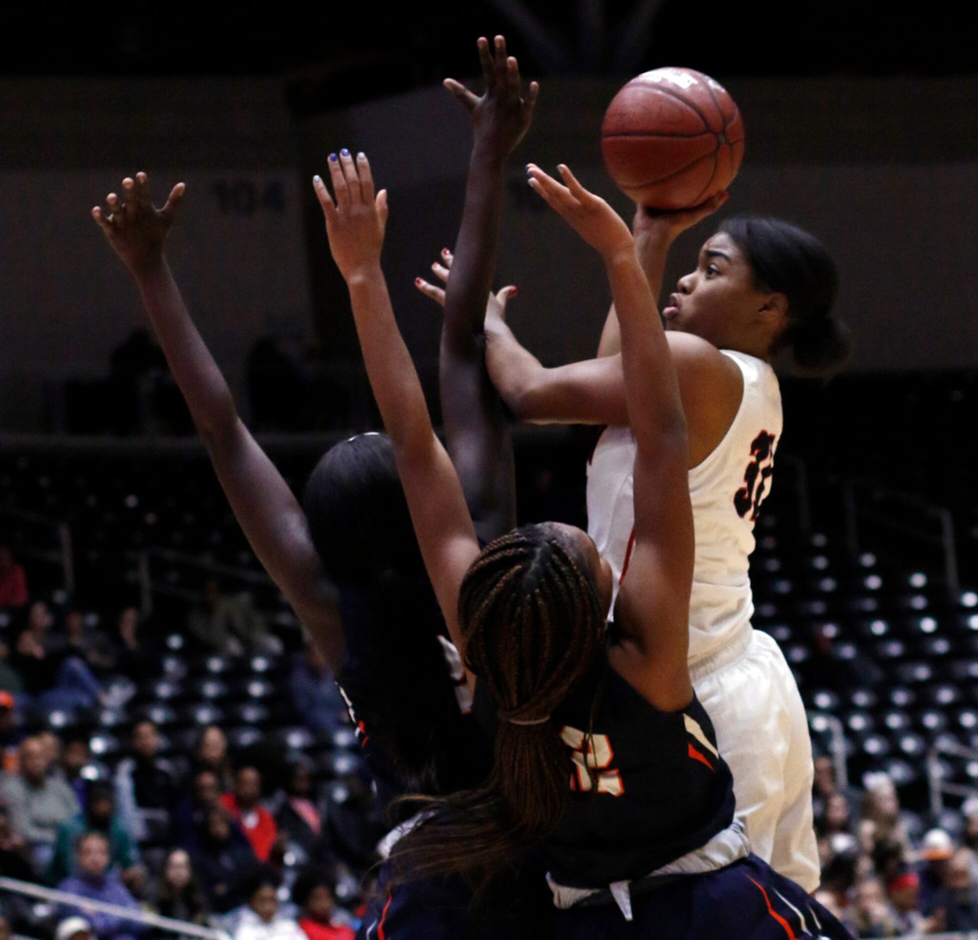 Allen guard Nyah Green (31) gets off a jump shot as she is defended by Sachse post Adhel Tac...