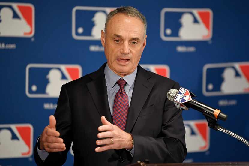 FILE - Major League Baseball commissioner Rob Manfred speaks during a news conference at the...