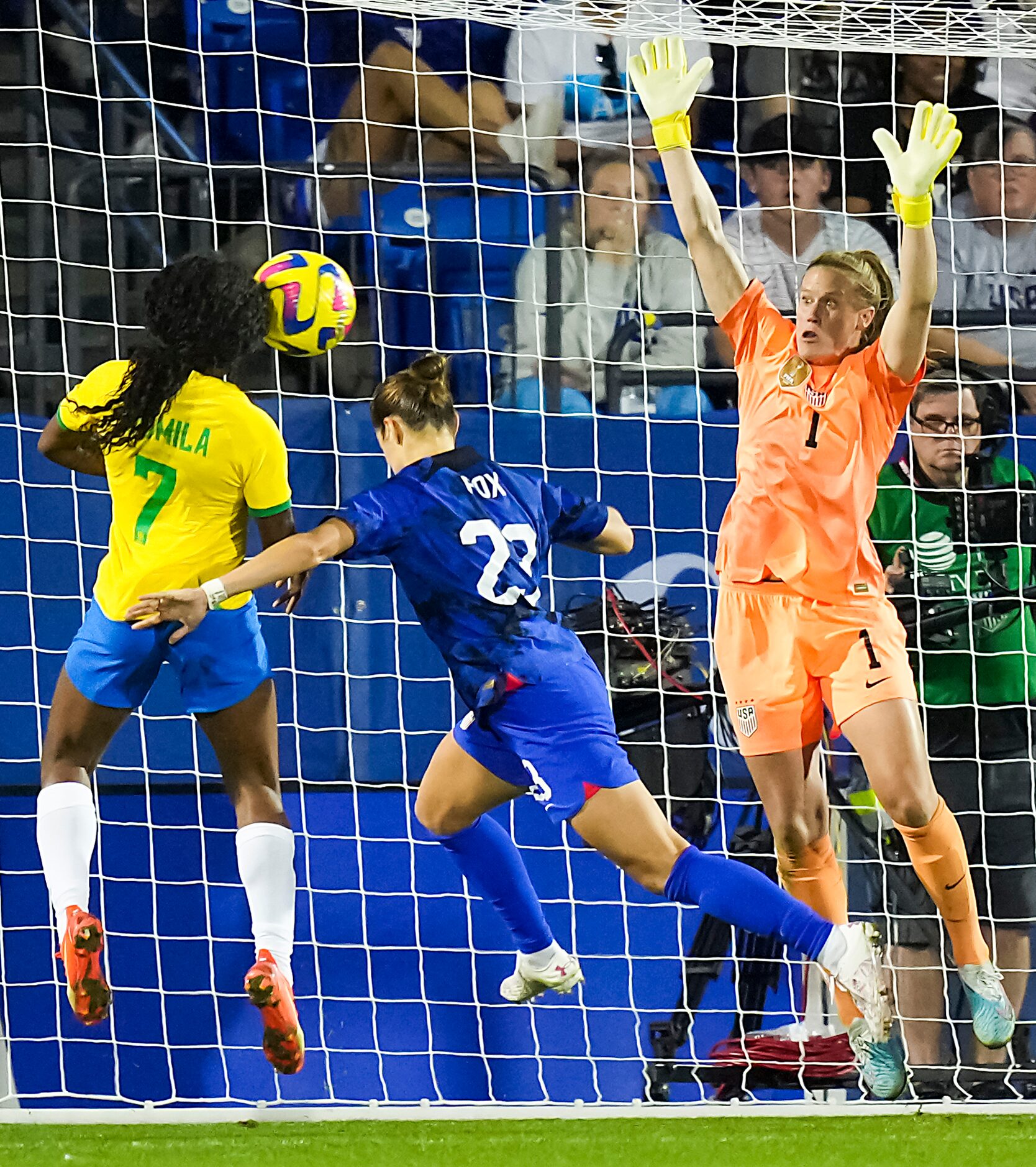 Brazil forward Ludmila (7) puts a header past United States goalkeeper Alyssa Naeher(1) and...