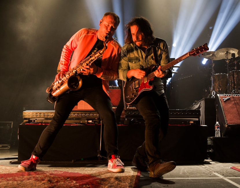 Saxophone player Rob Ingraham and guitar player Zack Feinberg of The Revivalists perform on...