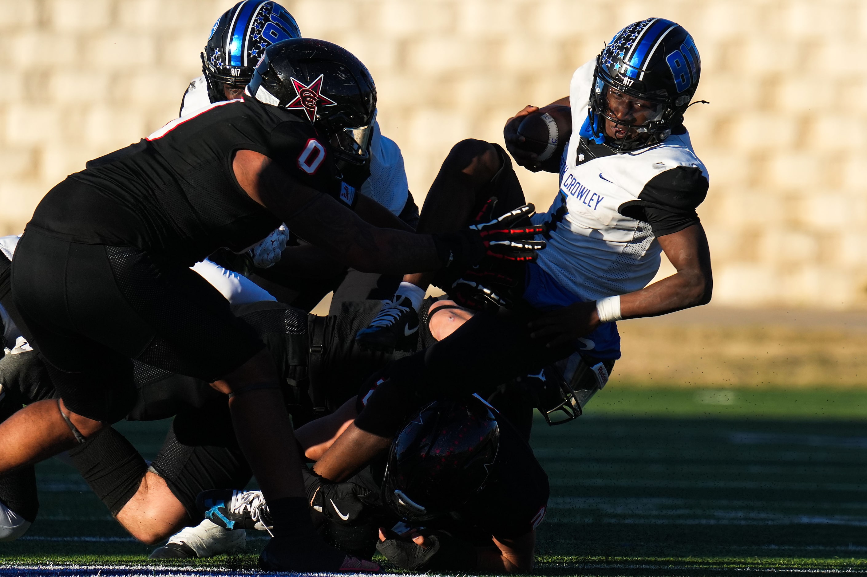 North Crowley running back Cornelius Warren (1) is brought down by the Coppell defense after...