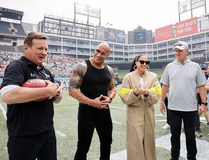 Arlington Renegades head coach Bob Stoops, from left, UFL owners Dwayne "The Rock" Johnson,...