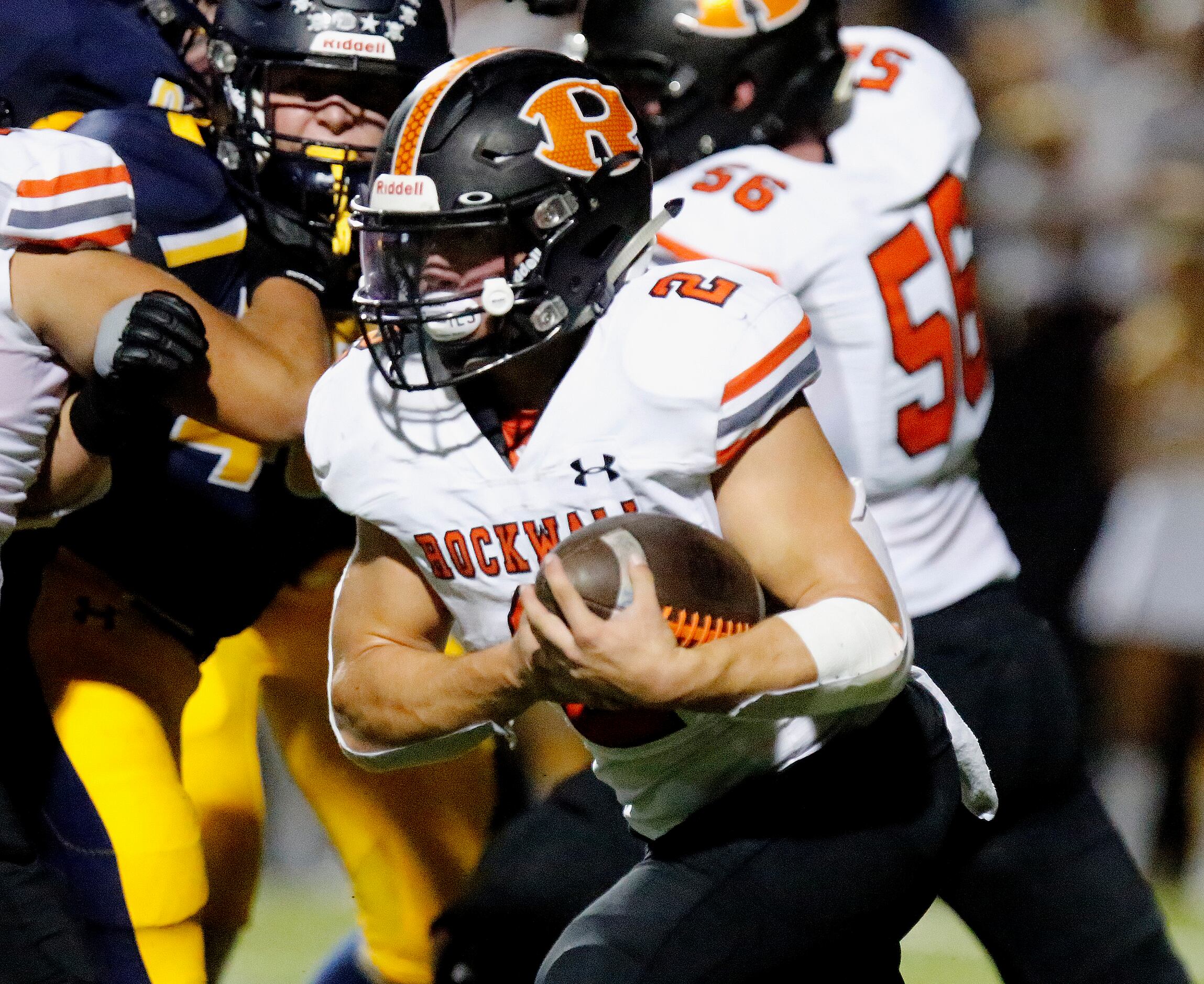 Rockwall High School running back Zach Hernandez (2) carries the football during the first...