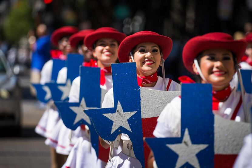 The Trinity Valley Community College Cardettes march down Main Street during the annual...