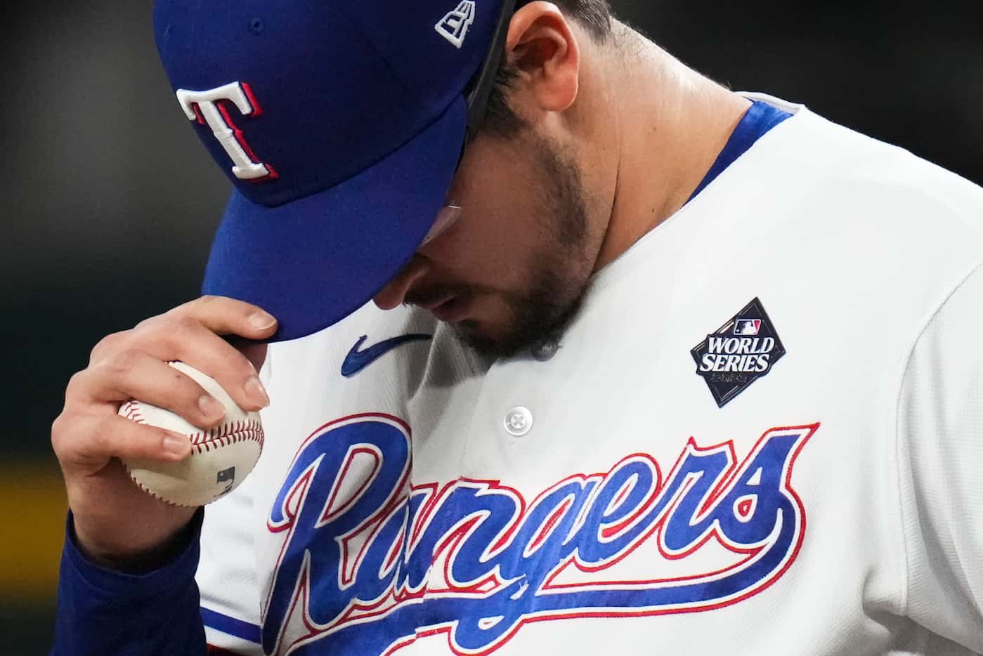 Texas Rangers pitcher Dane Dunning adjusts his cap during a team workout at Globe Life Field...