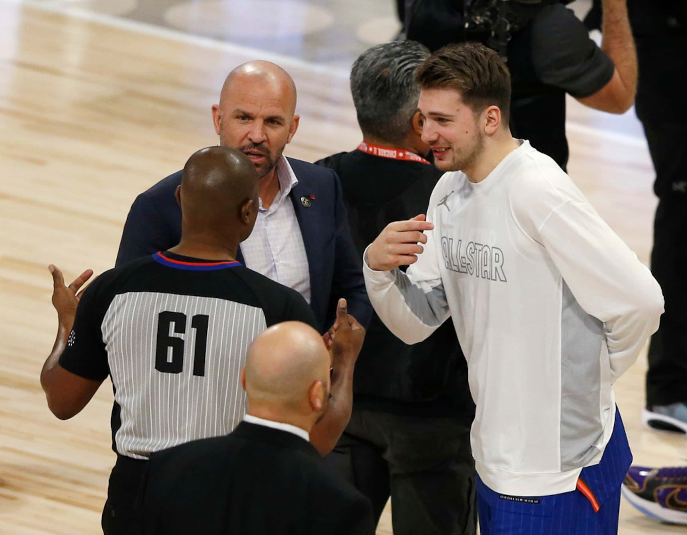 Team LeBron's assistant coach Jason Kidd and Luka Doncic talk with an official during a...