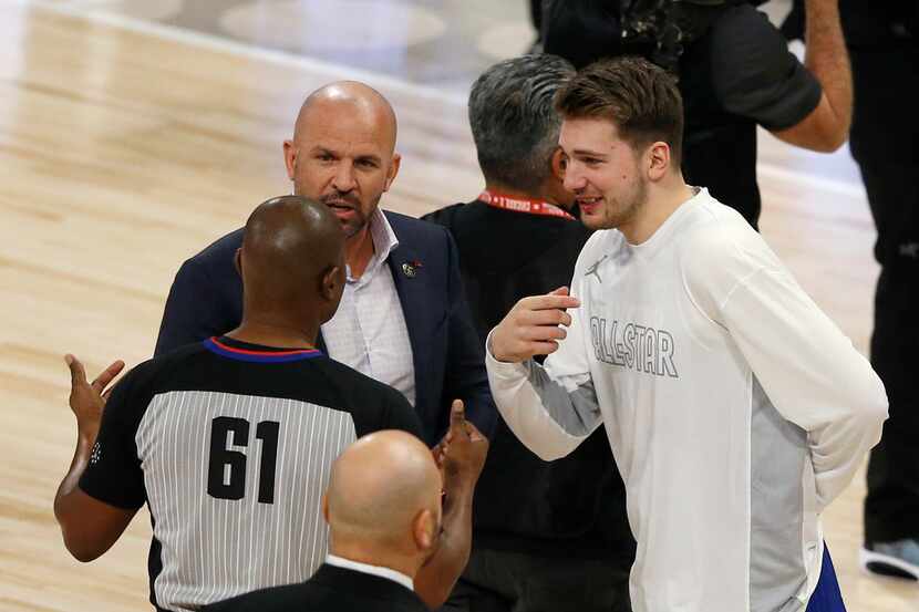Team LeBron's assistant coach Jason Kidd and Luka Doncic talk with an official during a...
