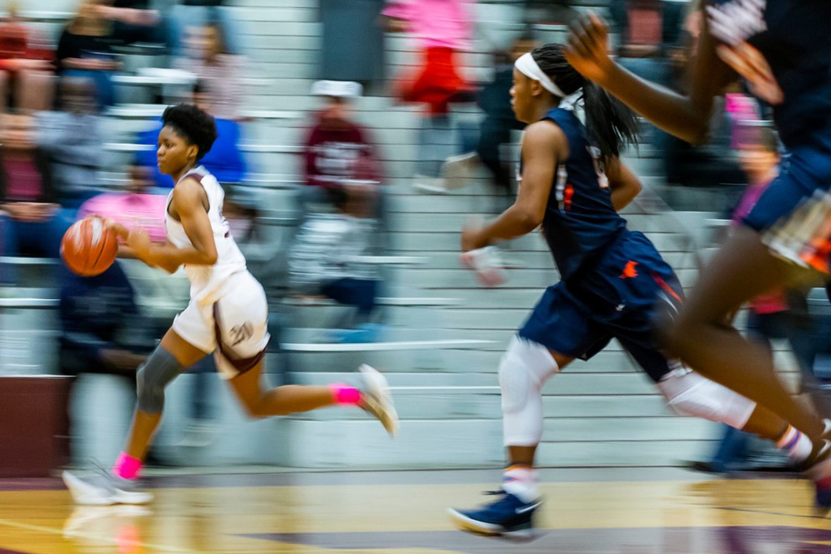 Rowlett forward Ngozi Obineke (20) brings the ball up the court during a District 10-6A...