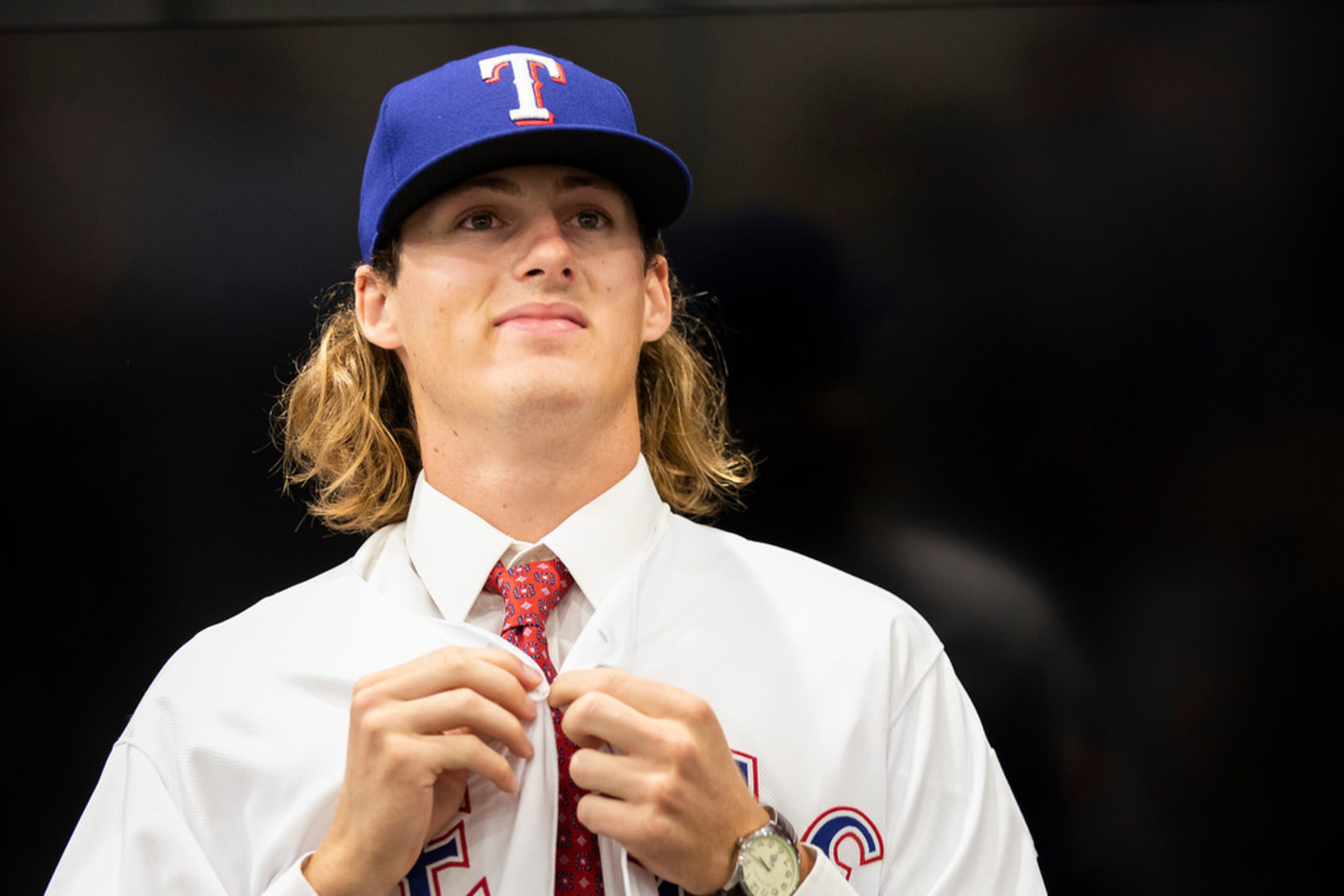 Texas Rangers 4th round pick, pitcher Mason Englert  of Forney (TX) High School, dons a...