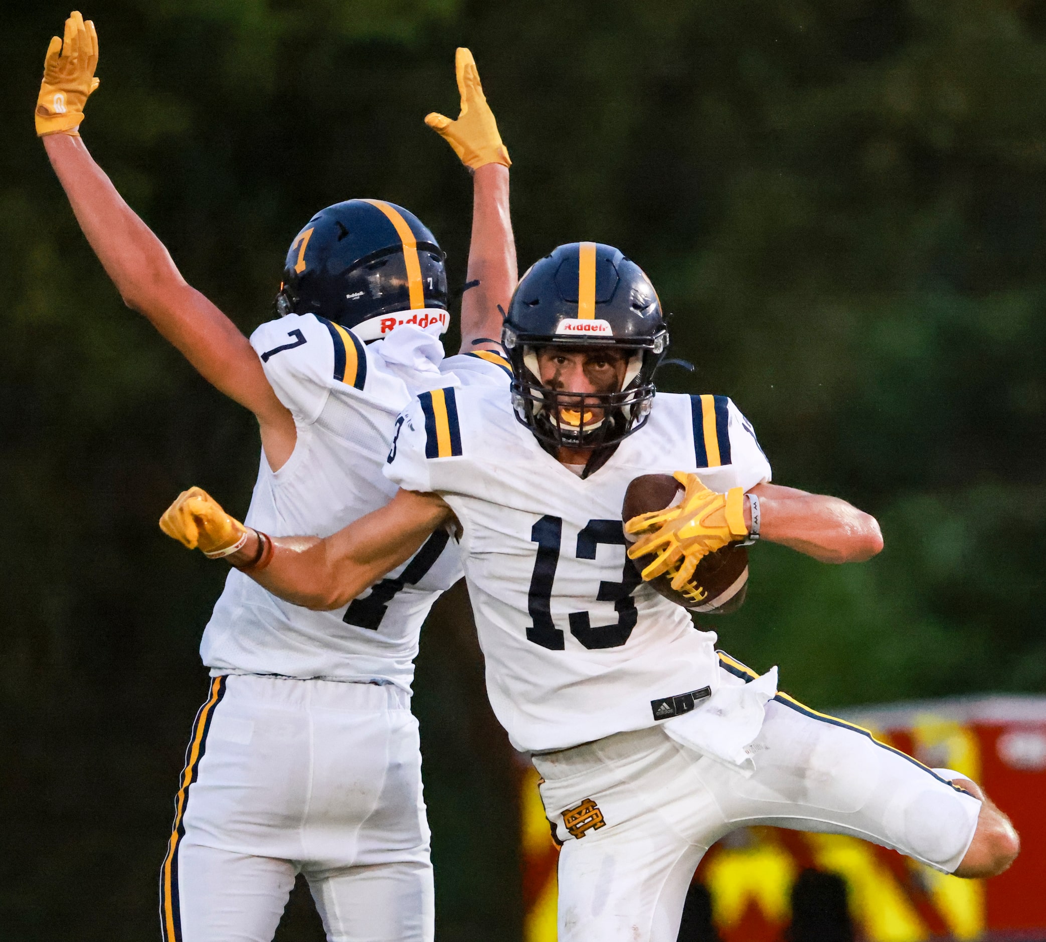 St. Mark's School of Texas Blake Malouf (7) and Mateu Parker (13) celebrate as he scores a...