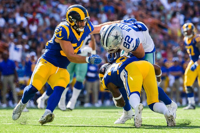 Dallas Cowboys tight end Jason Witten (82) is tackled by Los Angeles Rams defensive back...