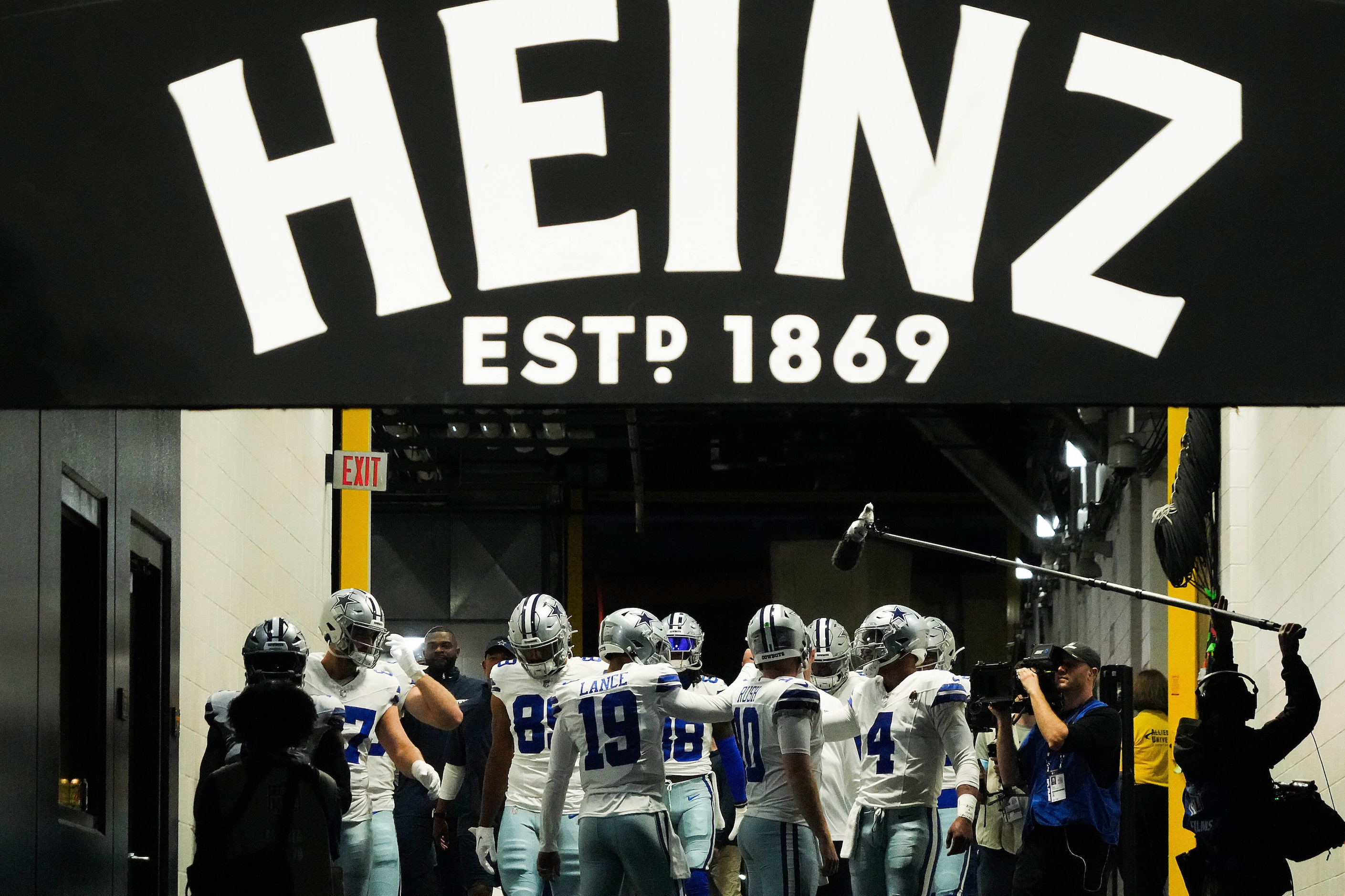 Dallas Cowboys quarterback Dak Prescott (4) huddles with teammates in the tunnel before...