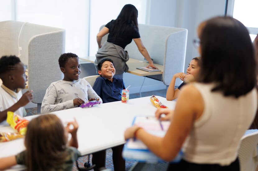 Students laughed during snack time on the first day of Heart House on Monday, Sept. 18,...