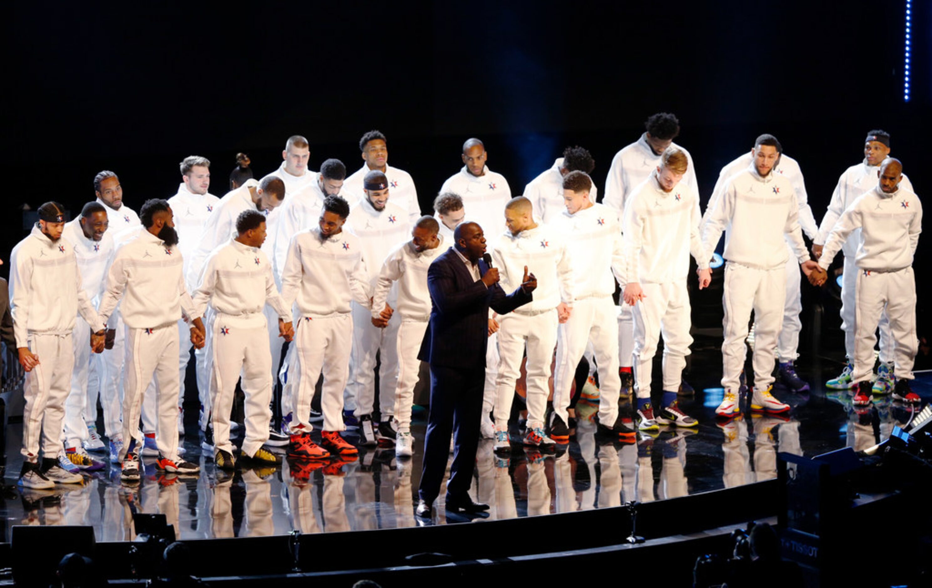 Magic Johnson tells everyone to hold hands during a tribute to Kobe Bryant in the NBA...