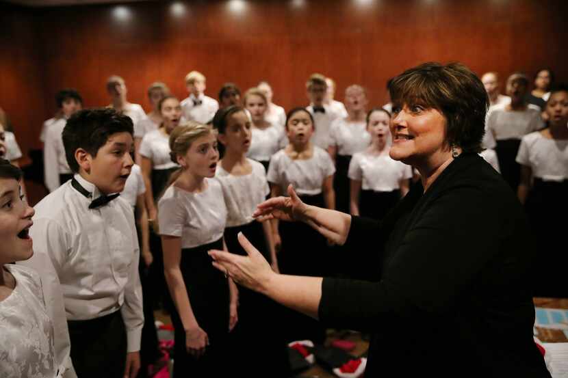 Terrie Preskitt-Brown rehearses with members of the Children's Chorus of Greater Dallas...