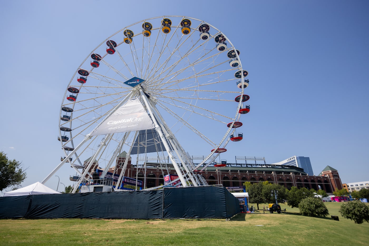 Finishing touches continue around the Ferris wheel at MLB's All-Star Village in Arlington on...