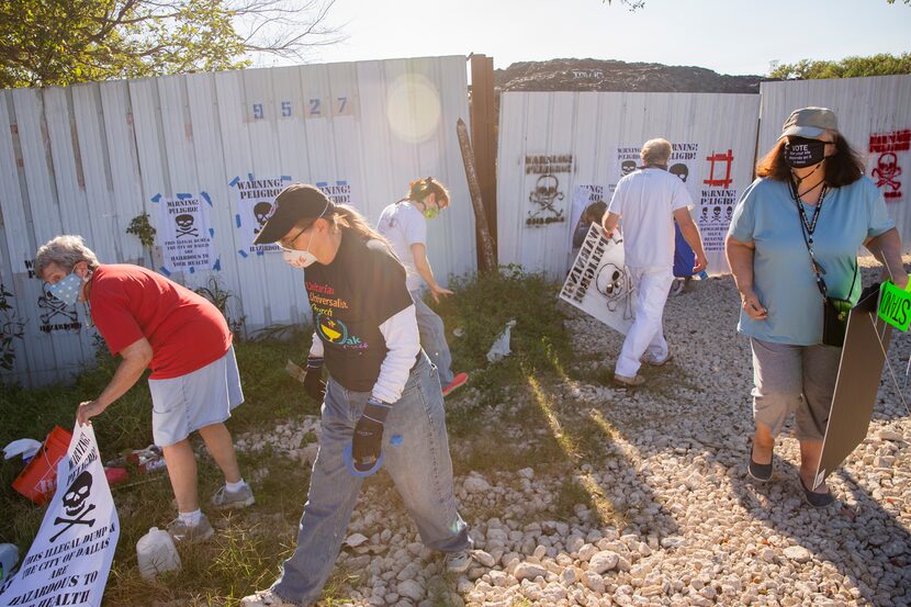 Local environmental activists posts signs declaring Shingle Mountain," the former Blue Star...