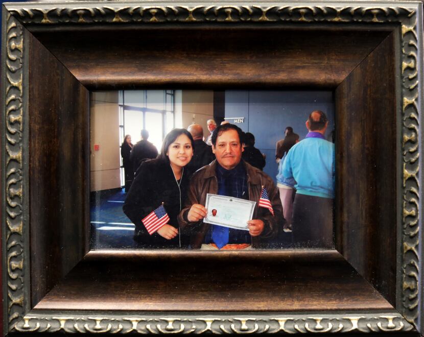 At Monica Lira Bravo's law firm, she displays this framed photo of herself and her father,...