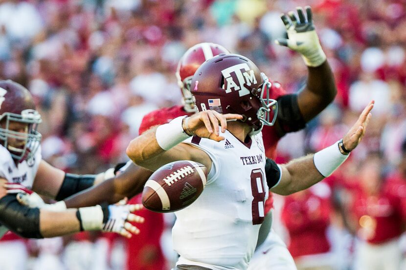 Texas A&M quarterback Trevor Knight (8) fumbles under pressure from Alabama defensive...