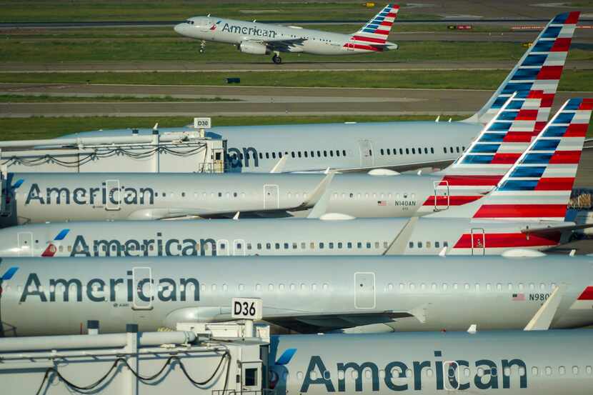 An American Airlines plane takes off frrom Terminal D at DFW Airport on Saturday, Sept. 24,...