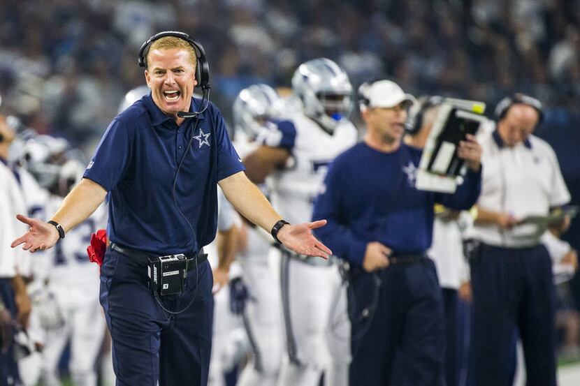 Dallas Cowboys head coach Jason Garrett questions a call by officials during the first...