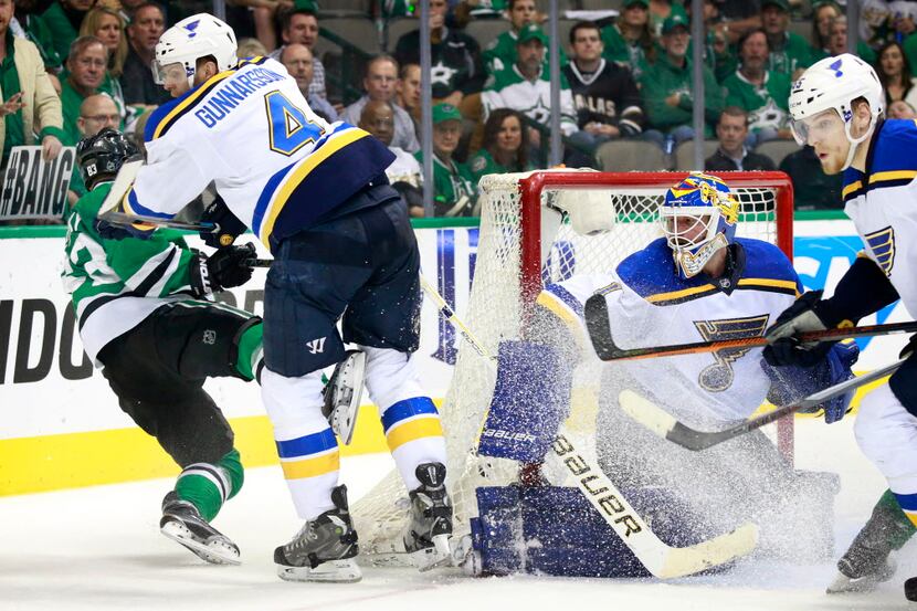 Dallas Stars right wing Ales Hemsky (83) is knocked to the ice by St. Louis Blues defenseman...