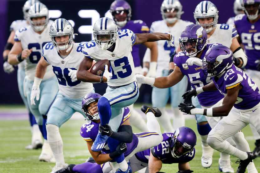 Dallas Cowboys wide receiver Michael Gallup (13) breaks free of Minnesota Vikings safety...