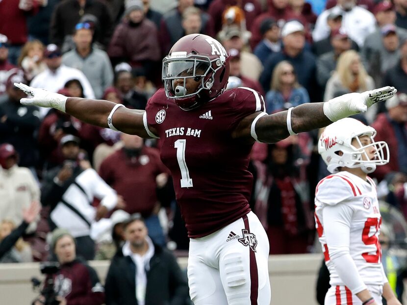 FILE - Texas A&M linebacker Buddy Johnson (1) celebrates after Mississippi kicker Luke...