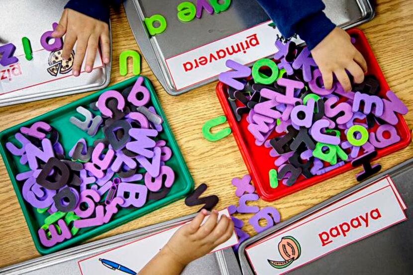 
Pre-kindergarten elementary students at Caillet Elementary School use letters to spell out...