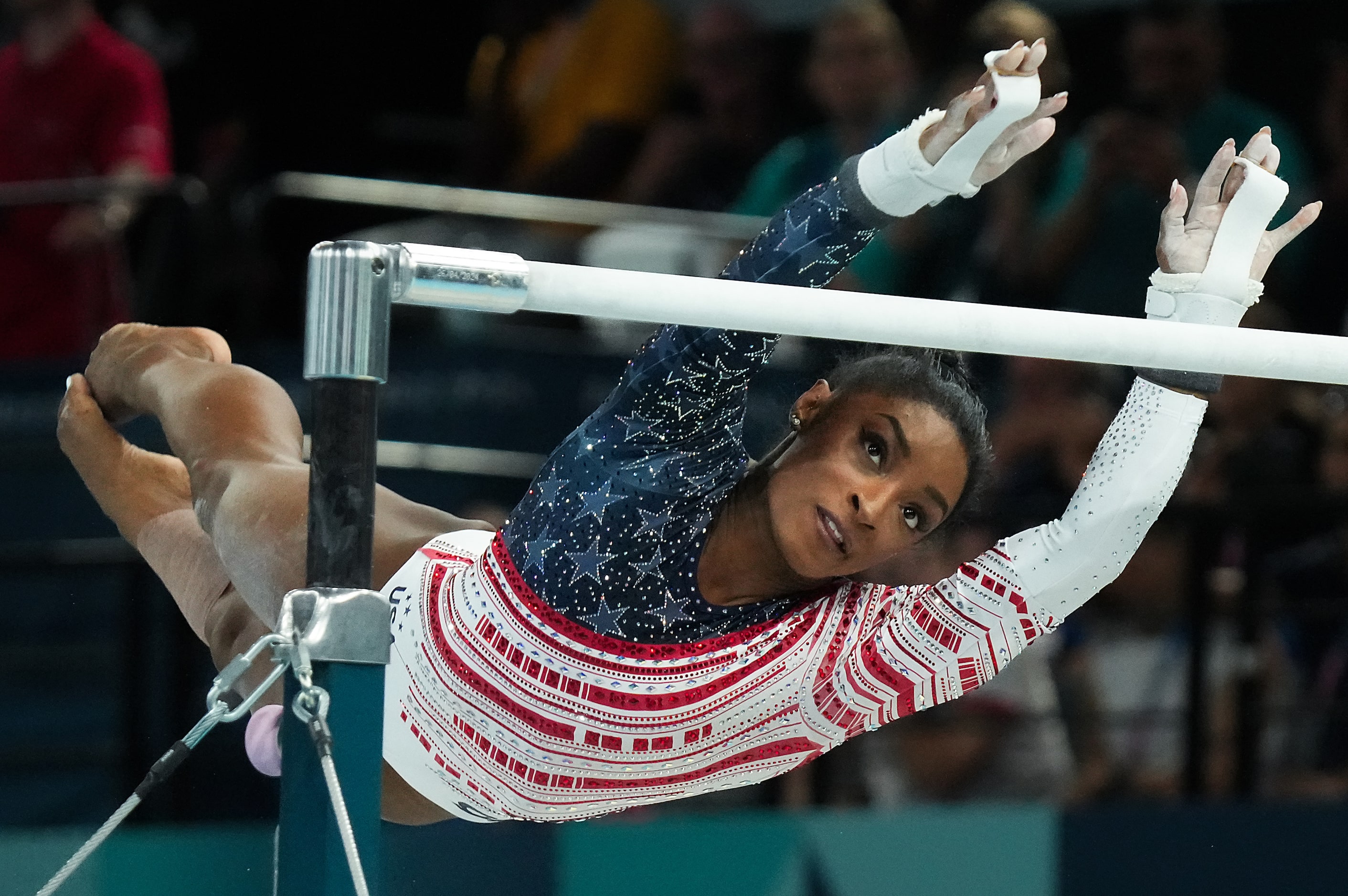 Simone Biles of the United States competes on the uneven bars during the women’s gymnastics...