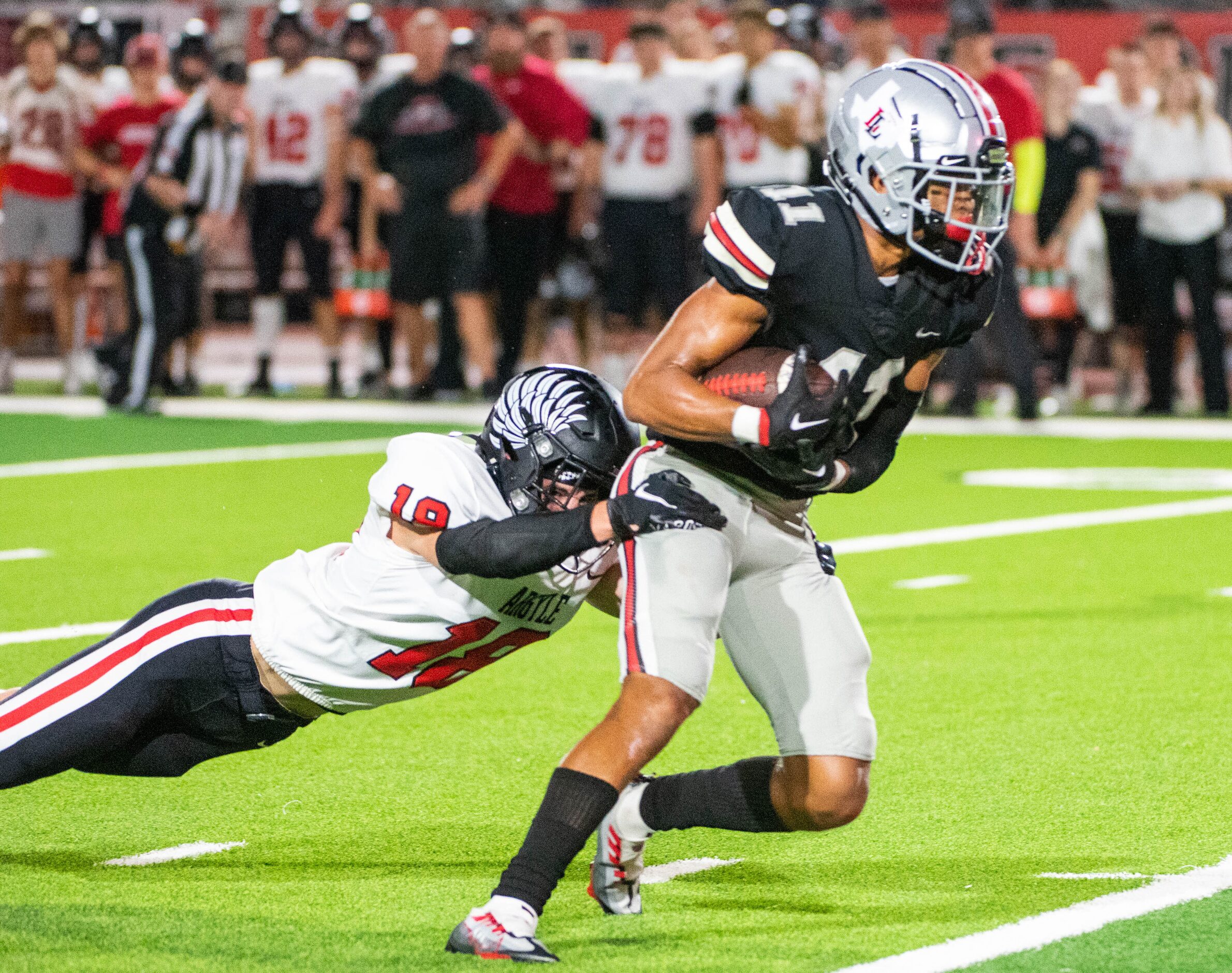 Lovejoy's Daylan McCutcheon (11) runs through a tackle attempt by Argyle's cornerback Parker...