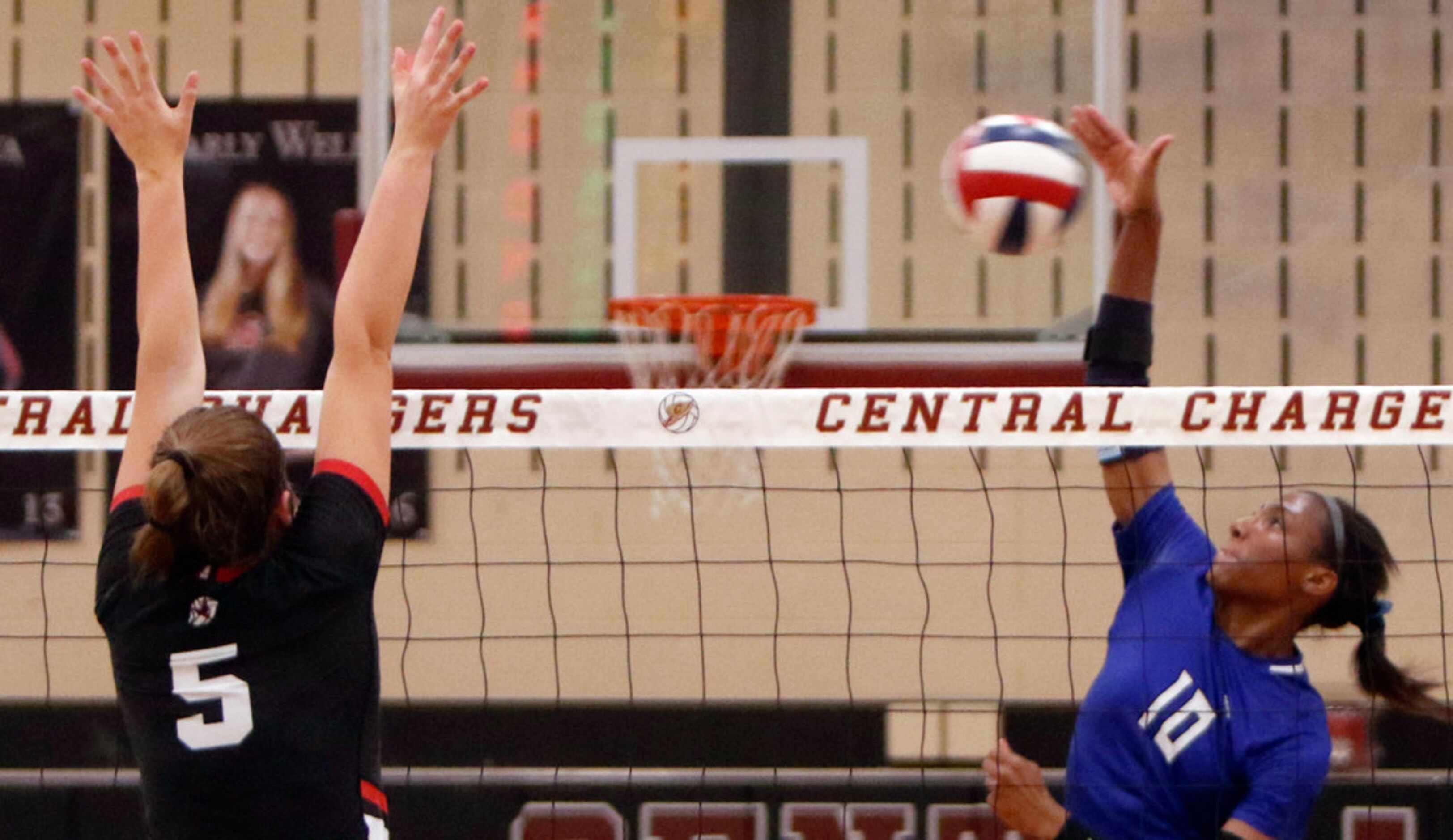 Trophy Club Byron Nelson outside hitter Charitie Luper (10) fires off a shot toward the...