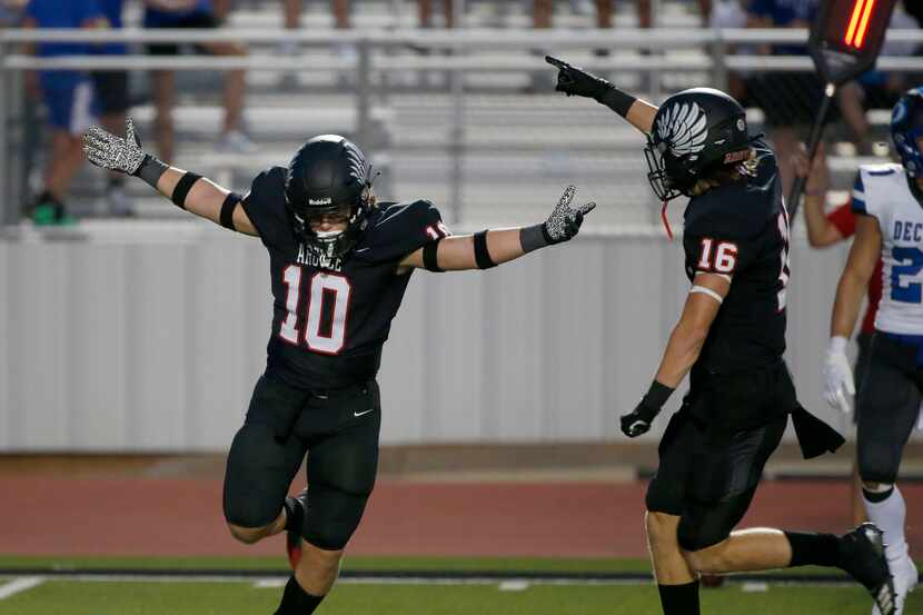 Argyles Will Ramsey (10) celebrates his interception against Decater with Jacob Robinson...