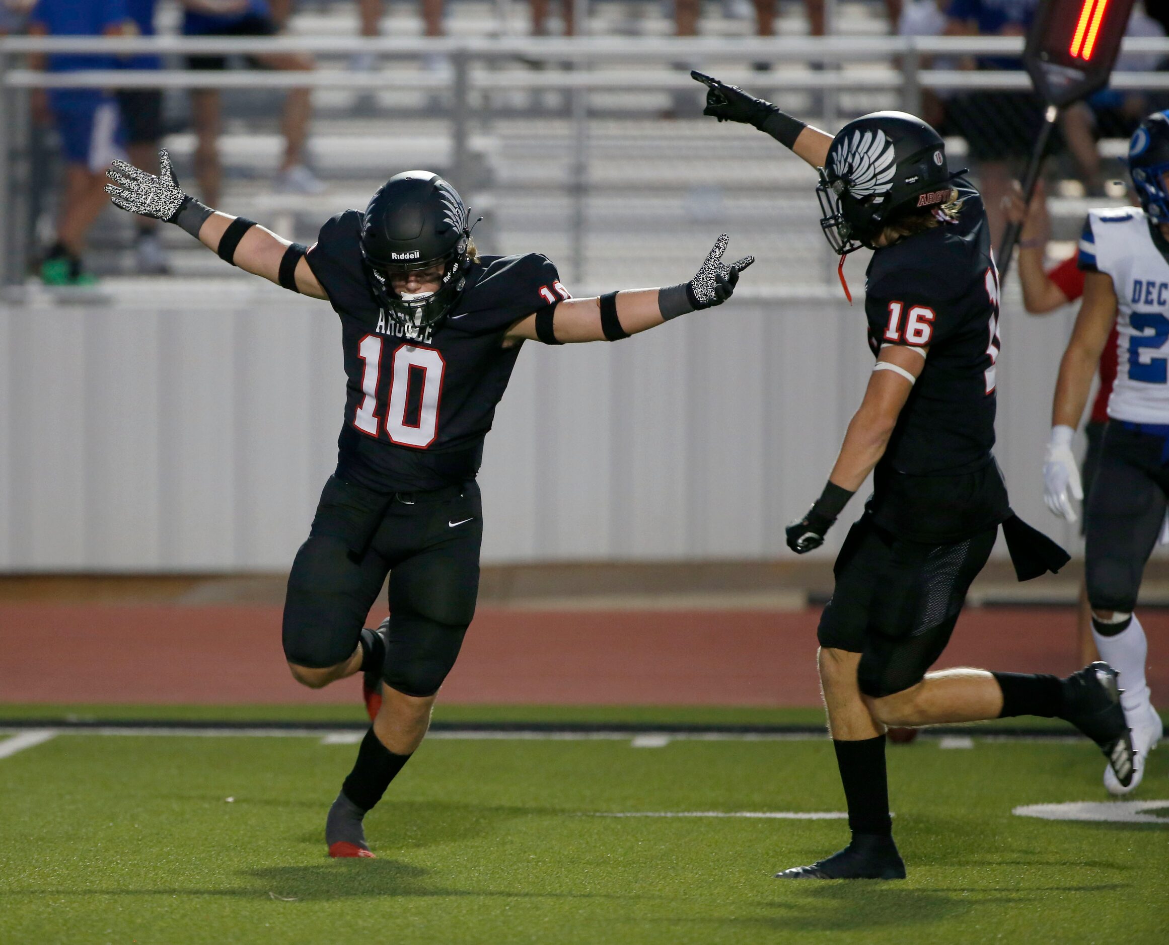 Argyles Will Ramsey (10) celebrates his interception against Decater with Jacob Robinson...