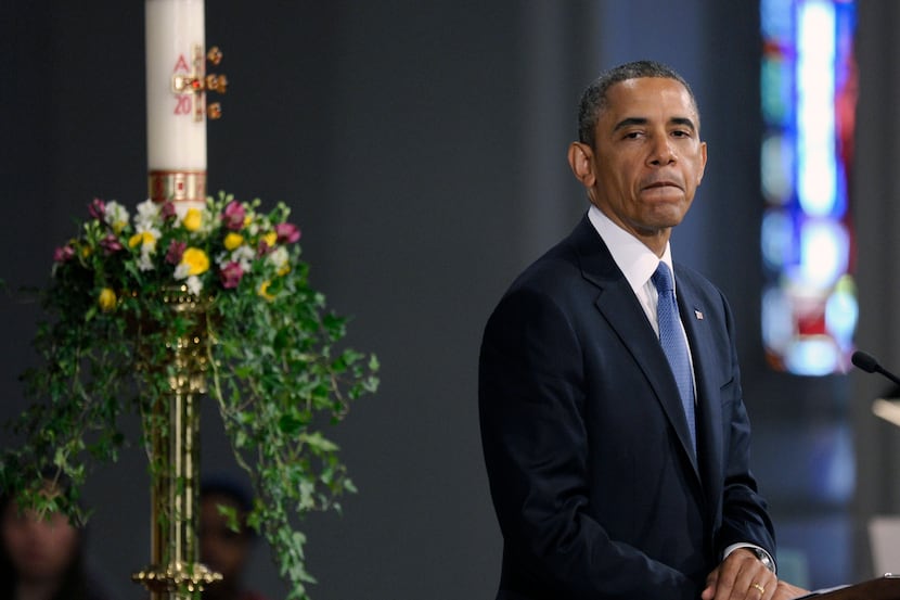 President Barack Obama pauses while speaking at the "Healing Our City: An Interfaith...