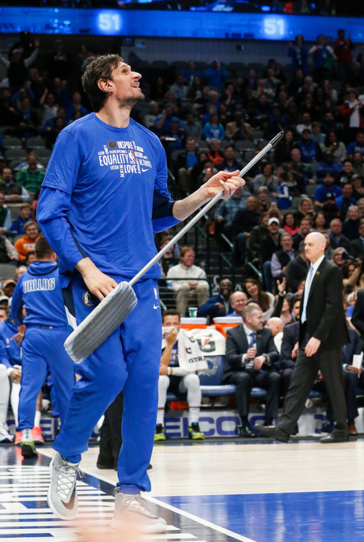 Dallas Mavericks center Boban Marjanovic (51) works to free the ball, which was lodge...