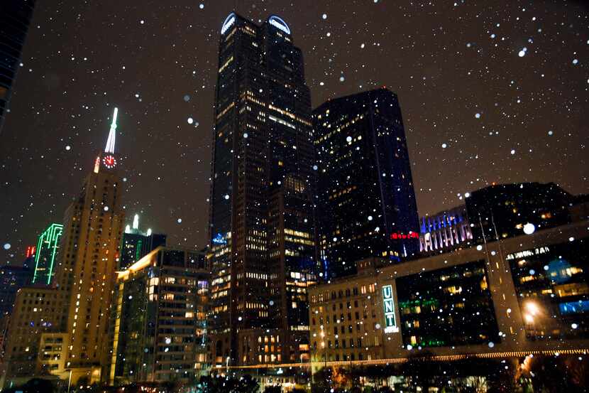 Downtown Dallas looked like the inside of a snow globe in this photo taken Monday evening,...