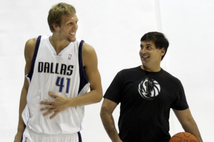 Mavericks Dirk Nowitzki and Mark Cuban joke around during a photo shoot during Mavericks...