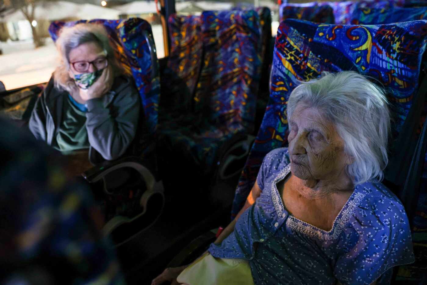 Gloria Sanders, 76, looks at her mother, Maria Barajas, who is 100 years old and has...