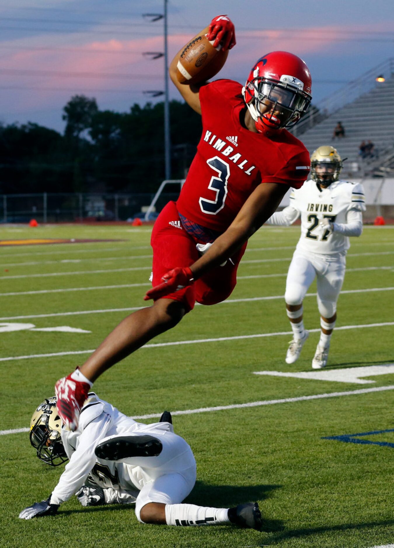 Kimball High RB Cortavious Smith (3) takes the high road to a first down during the first...