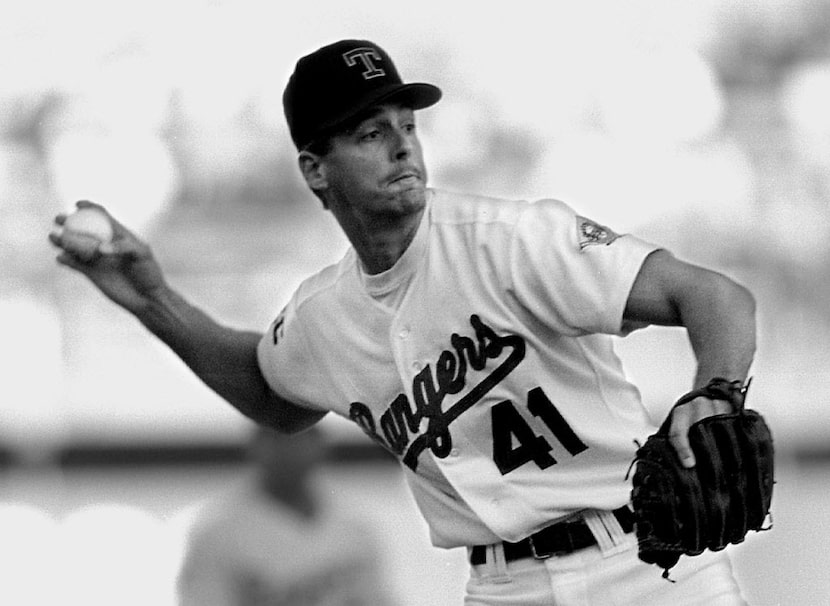 Caption: 9/28/93--Ranger's Kevin Brown throws out Oakland's Eric Helfand after bare-handing...