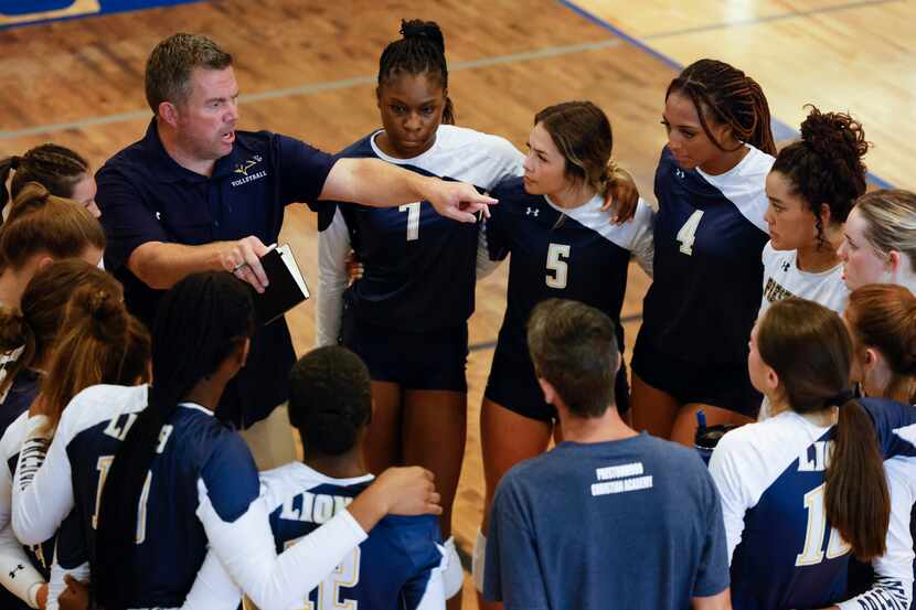 Plano Prestonwood Christian coach Ryan Mitchell instructs his players during a volleyball...