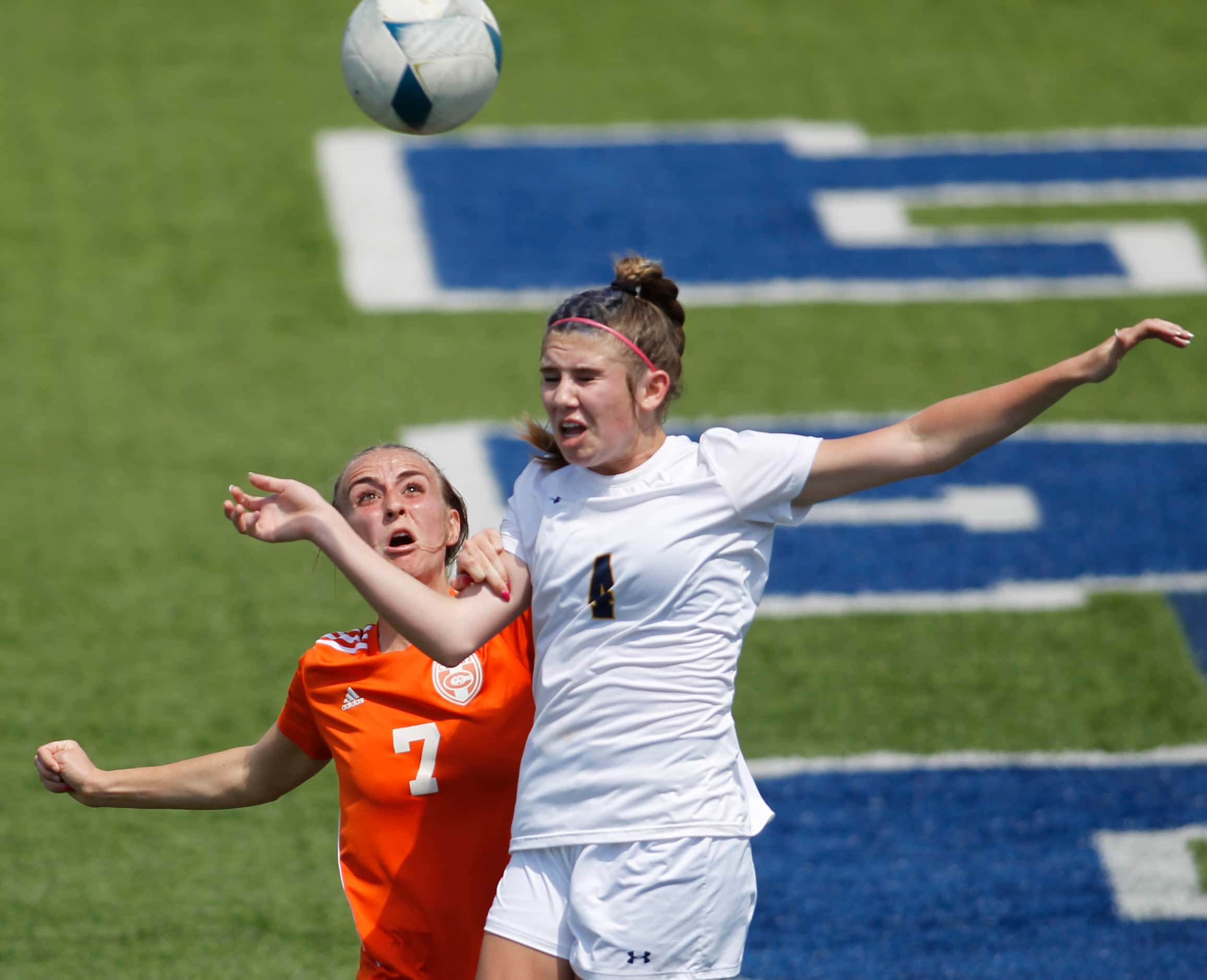 Celina's Lexi Truite (7) challenges Stephenville's Reese Schrrutka (4) to head a ball near...